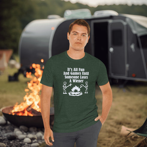 Our Camping tee features two adorable stick figure people roasting wieners over a cozy campfire. And with the hilarious slogan "It's All Fun & Games Until Someone Loses A Wiener," you'll be the life of the party at any camping trip!